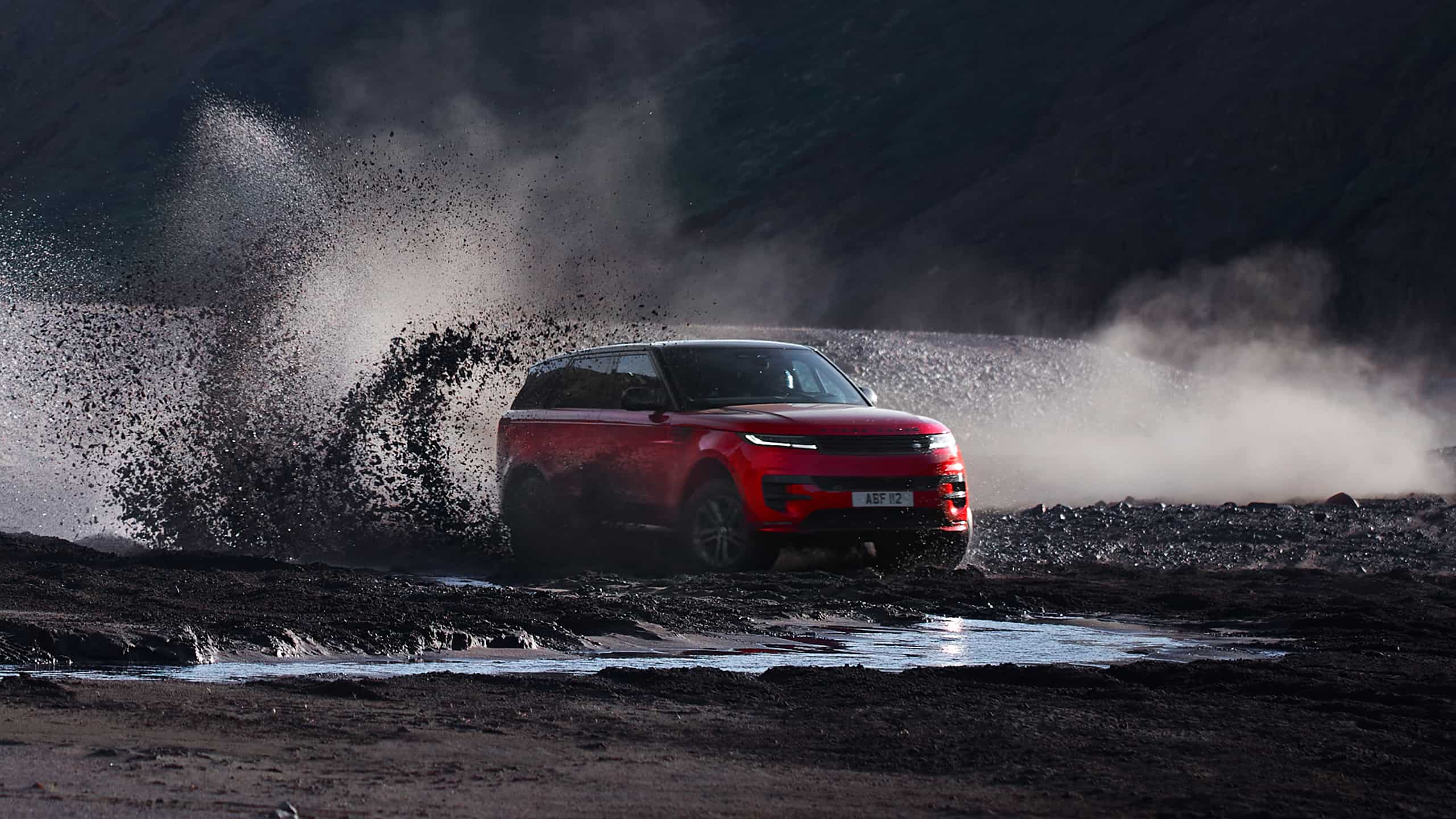 Range Rover Sport drifting over muddy off road