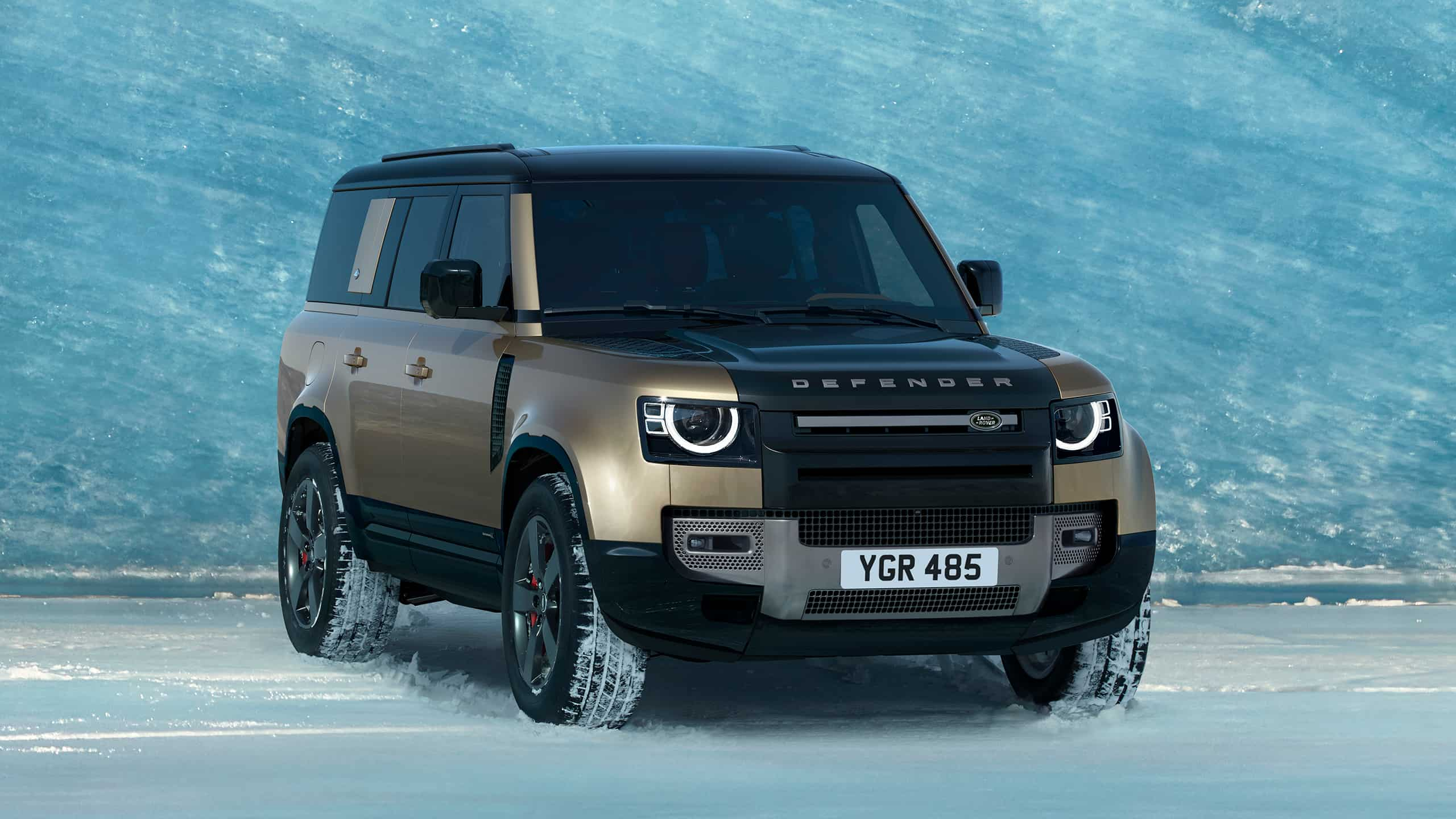 Defender running on snowy road