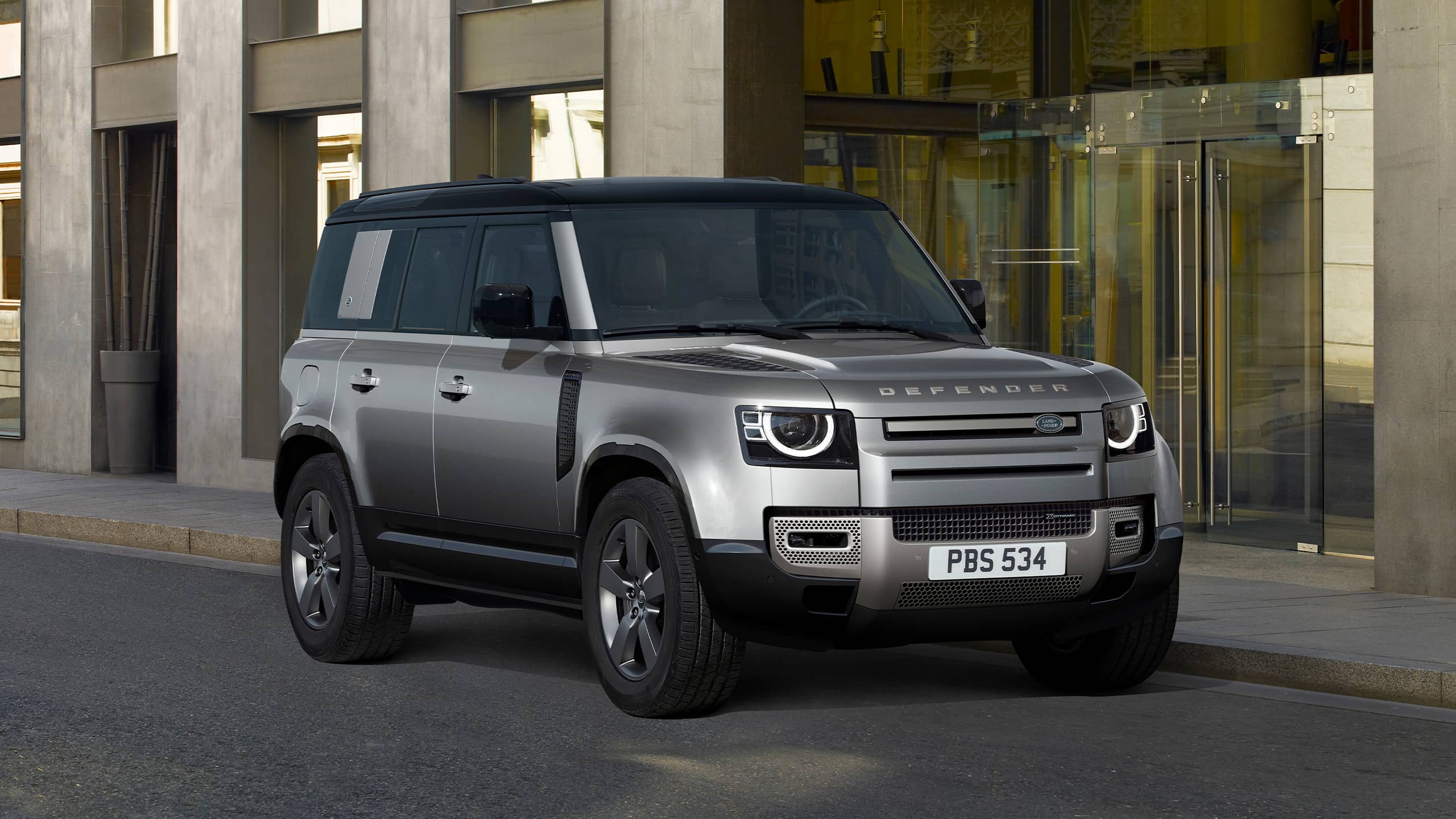 Defender Parked In Front Of Building