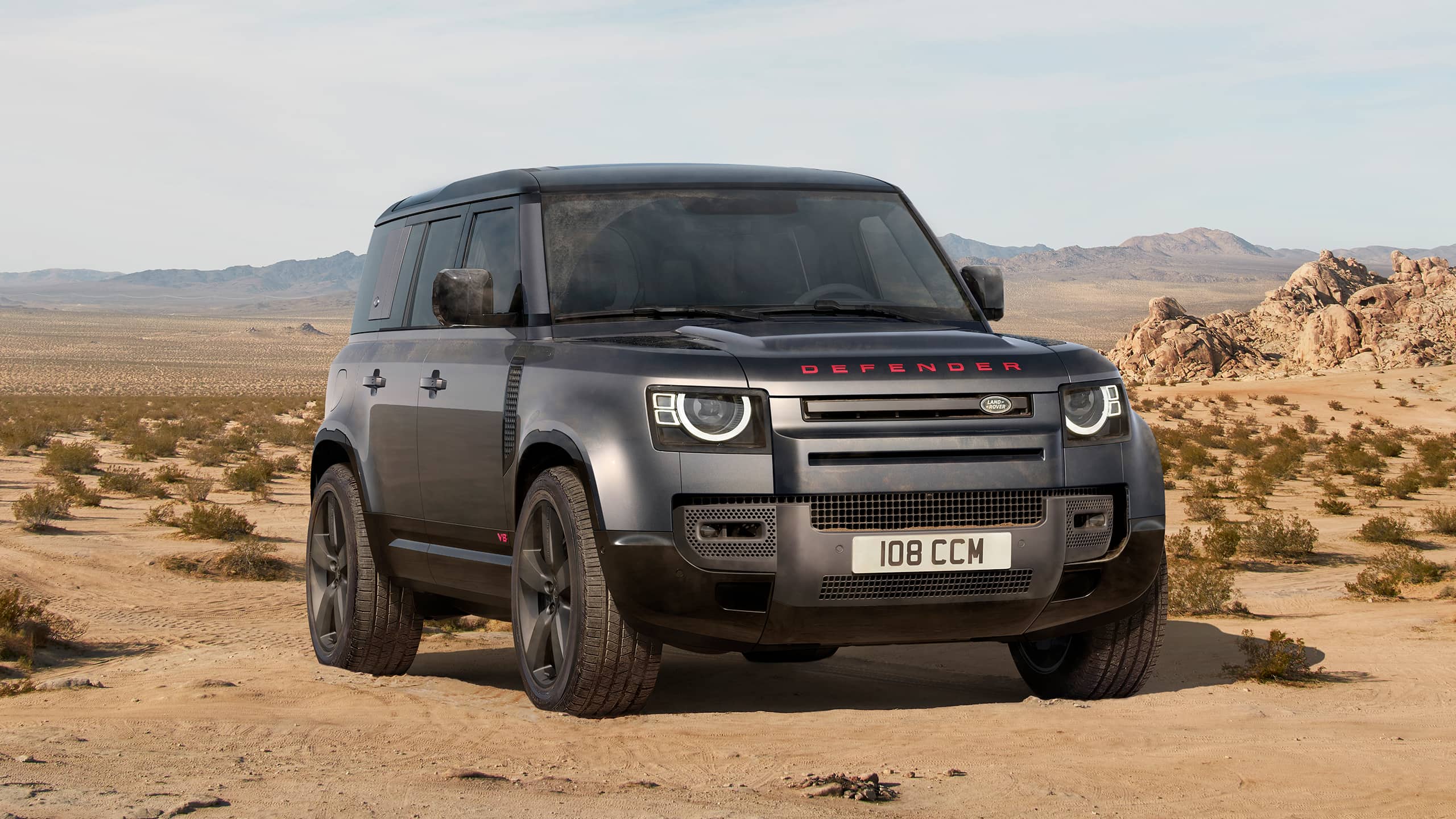 Defender Parked Over sand dust road