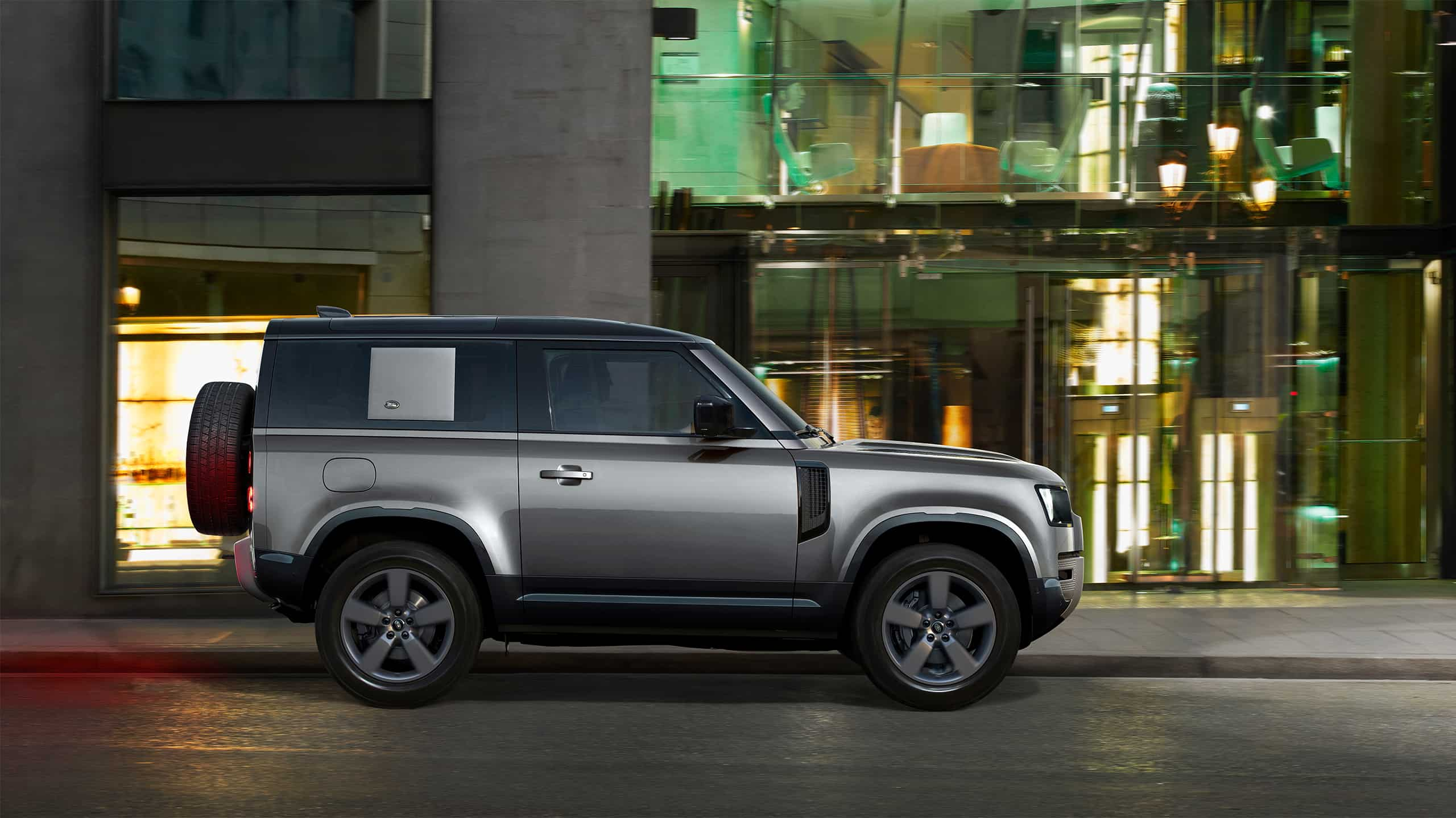 Land Rover Defender near the building 