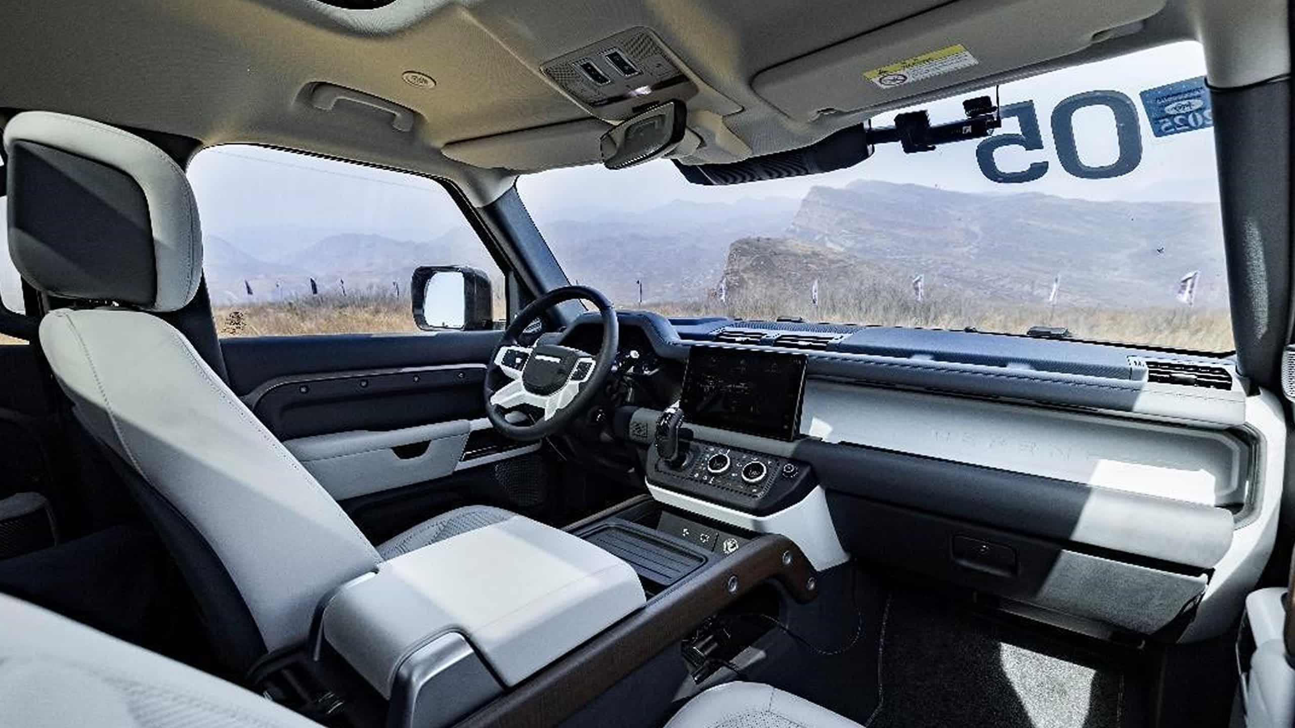 Land Rover Defender 130 with front row centre tunnel integrated refrigerator