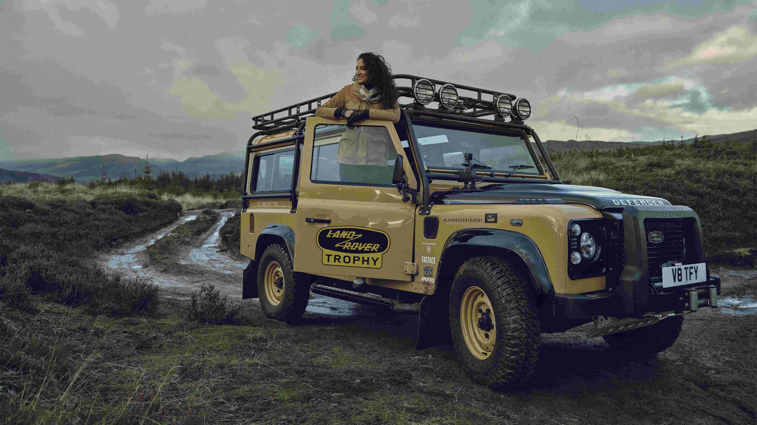 A girl is standing on the defender