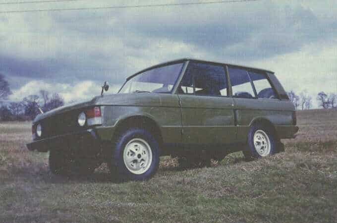 Old picture of a range rover in countryside