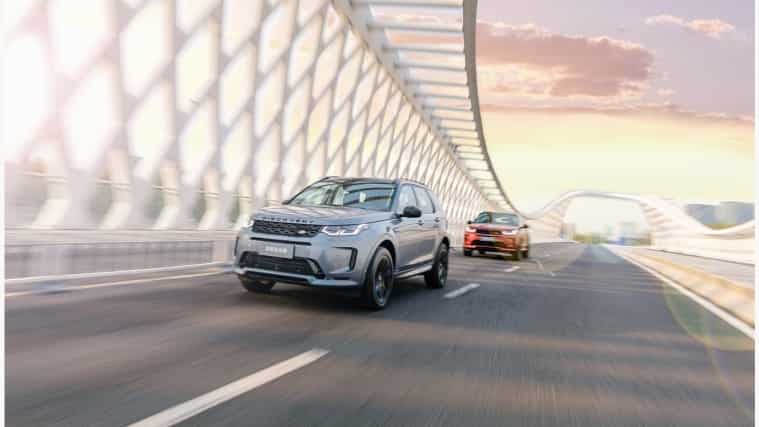 Land Rover Vehicles driving down a road