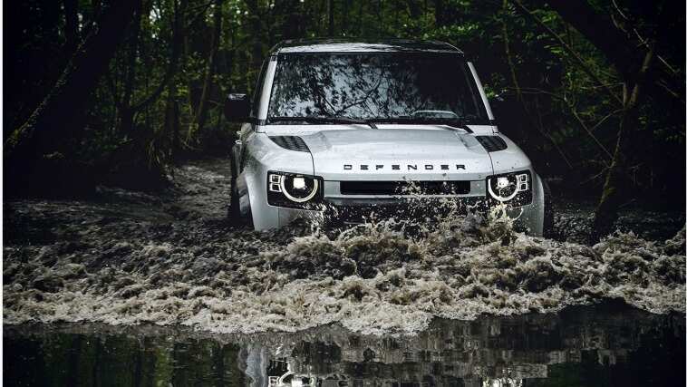 Land Rover Defender is driving in water