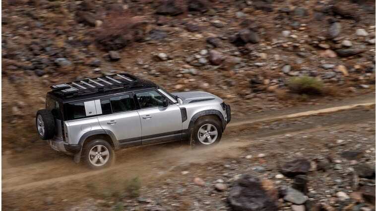 Land Rover Defender driving top side view