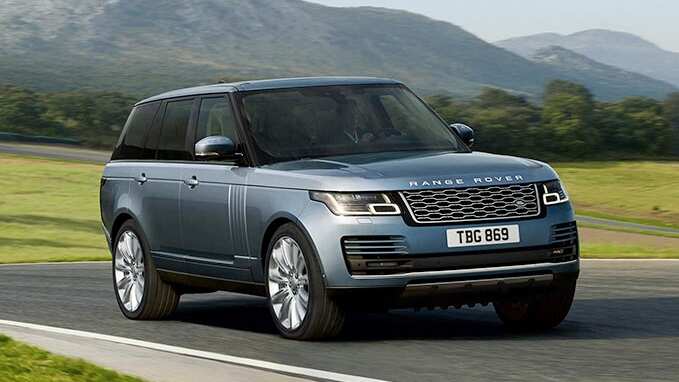 Range Rover in blue driving in countryside