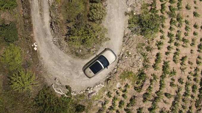 New Range Rover driving in fields top view