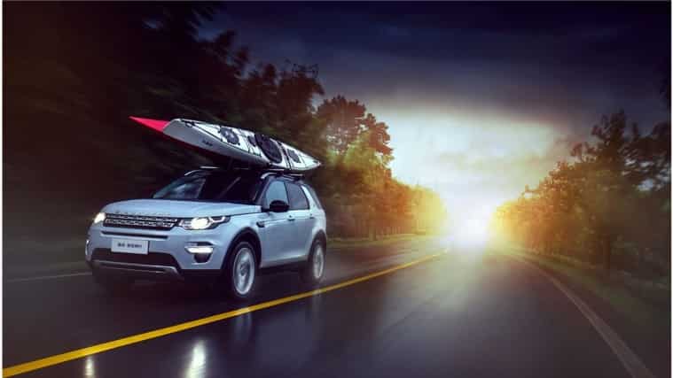 Land Rover on road with roof rack