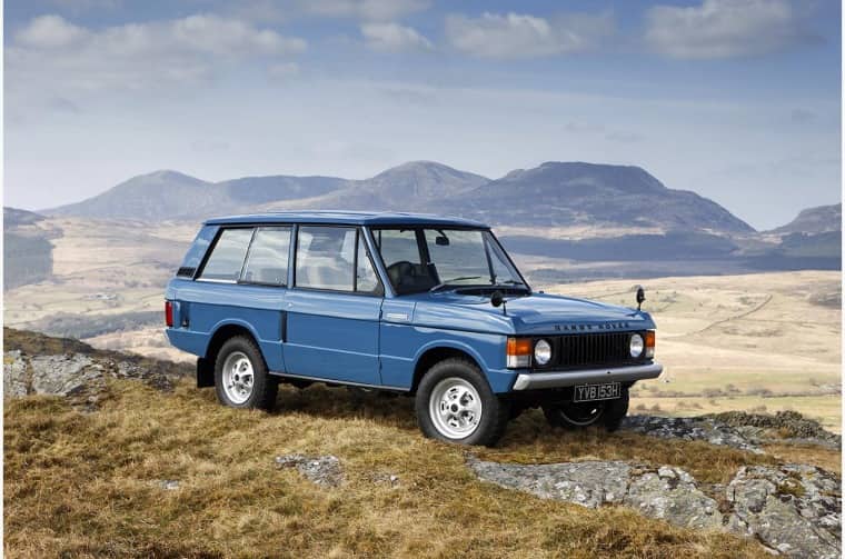Range Rover driving through mountain range