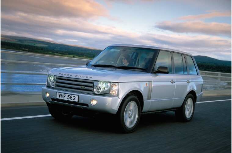 Range Rover driving on road