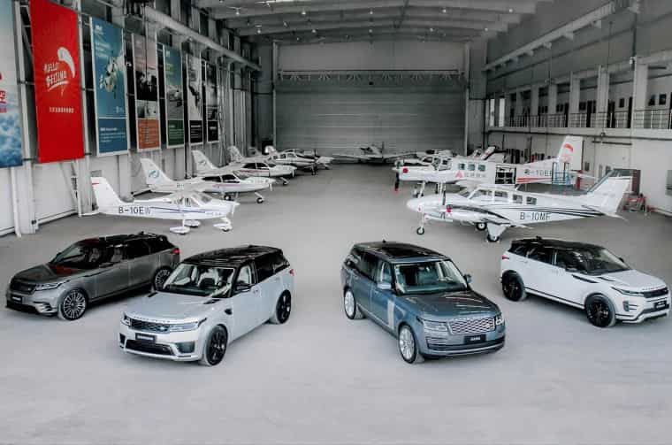 Range Rover vehicles in Airplane hanger 