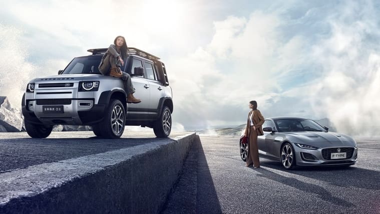 Women Next to Jaguar Land Rover Vehicles