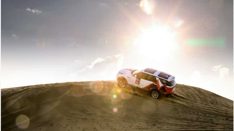 Land Rover Discovery driving up a hill