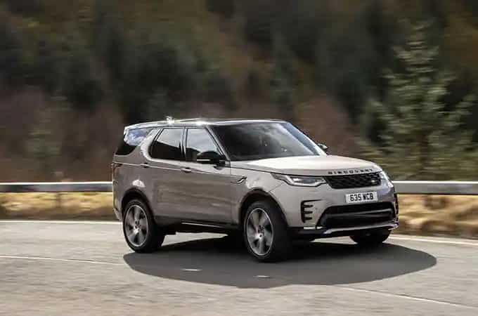 Land Rover Discovery driving on road