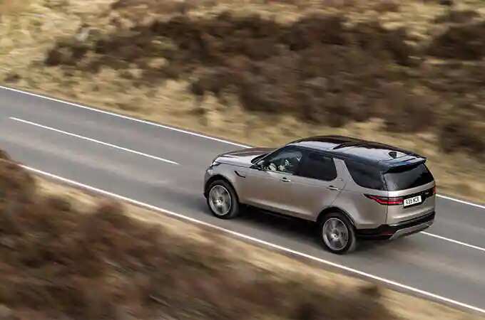 Land Rover Discovery driving on road