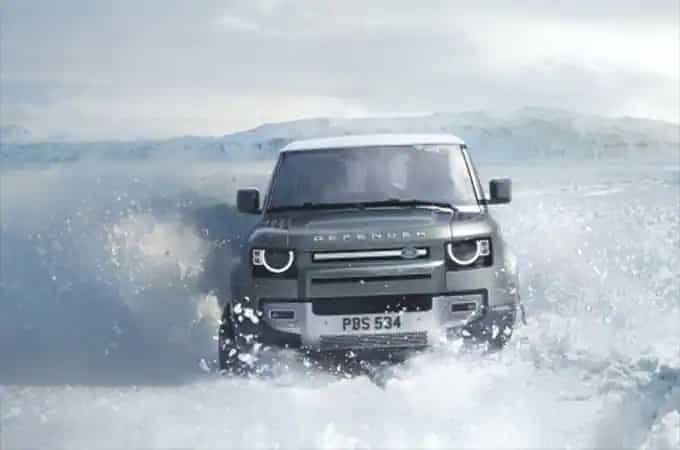 Land Rover Defender driving through water