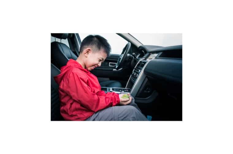 Child in Land Rover passenger seat
