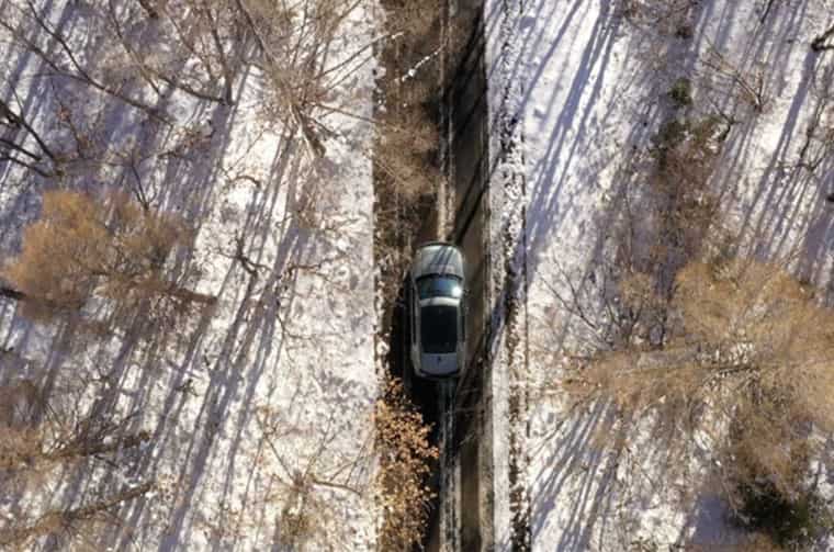 Aerial view of Land Rover Discovery on road