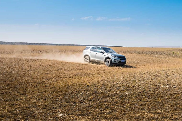 Land Rover Discovery Sport driving through desert