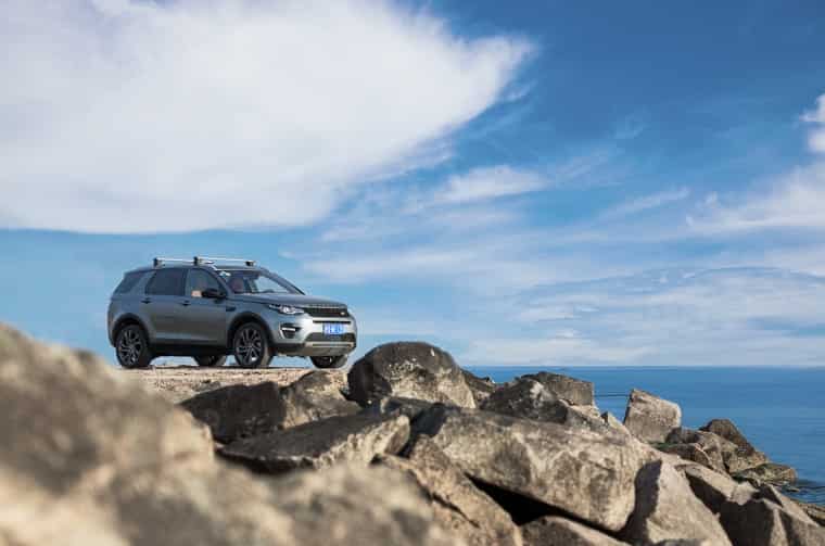 Land Rover Discovery parked on rocky cliff