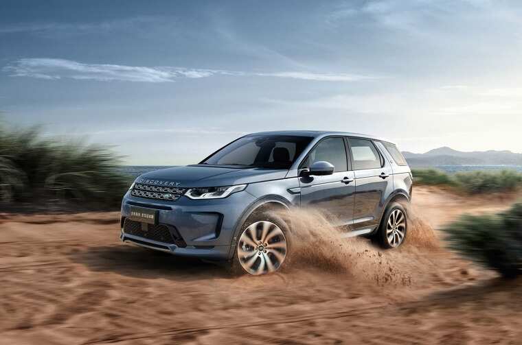 Land Rover Discovery driving on dirt road