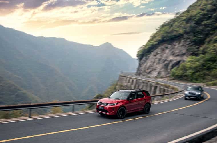 Land Rover Discovery driving on winding mountain road