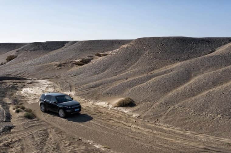 Range Rover driving in a desert