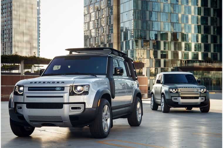 Land Rover Defenders parked in city