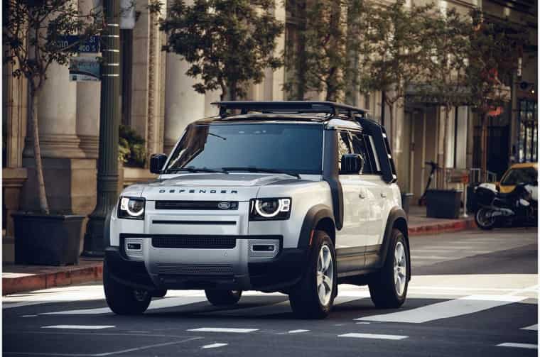 Land Rover Defender driving through city