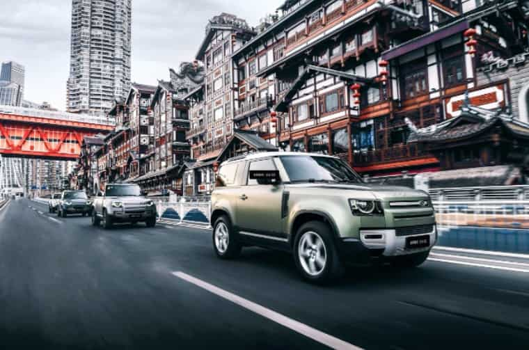 Land Rover Defender driving through city