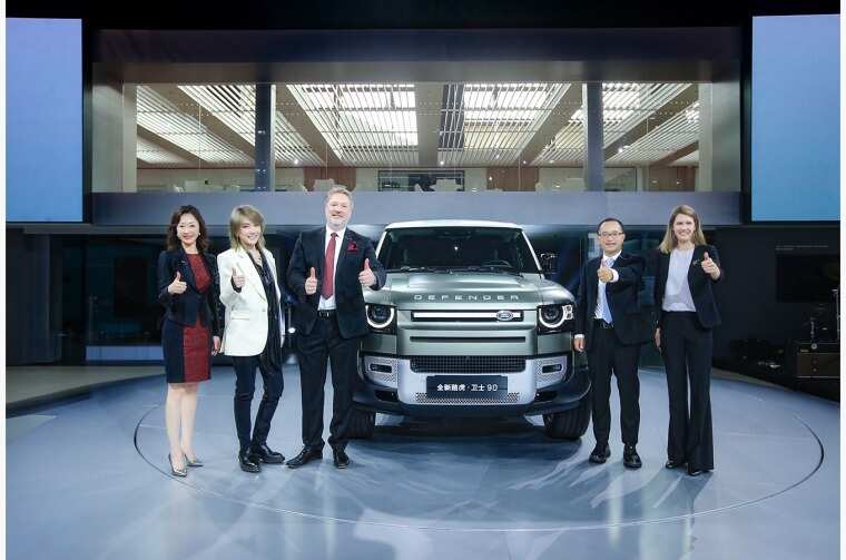 Group photo of Jaguar Land Rover executives and guests