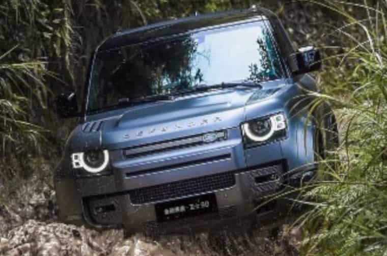 Land Rover Defender driving through water