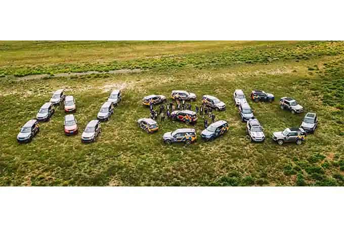 Land Rover vehicles arranged to spell NSD
