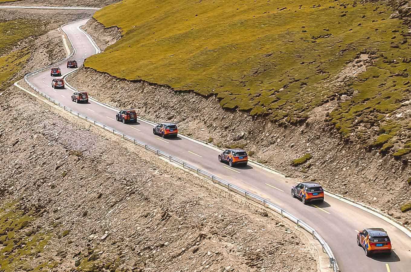 Land Rover convoy driving on road