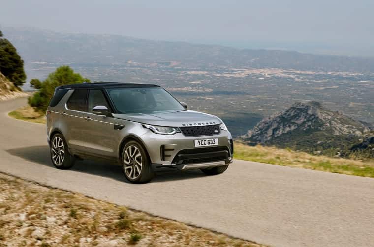 Land Rover Discovery driving on road