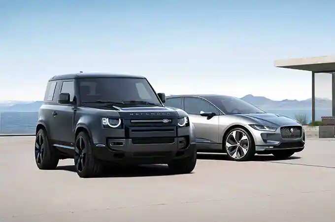 Land Rover Defender 90 parked next to Jaguar I-Pace