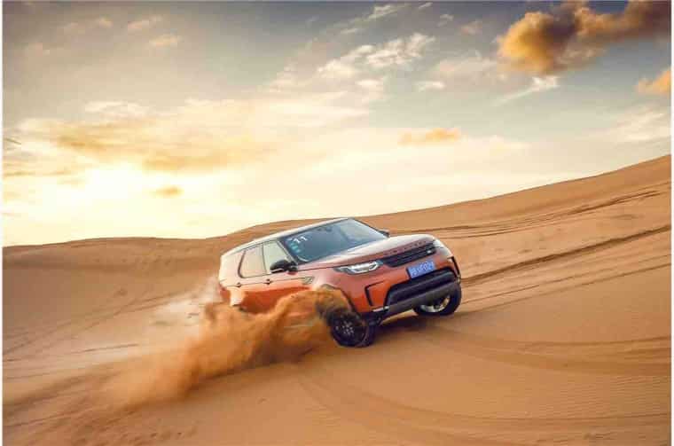 Land Rover Discovery driving in desert