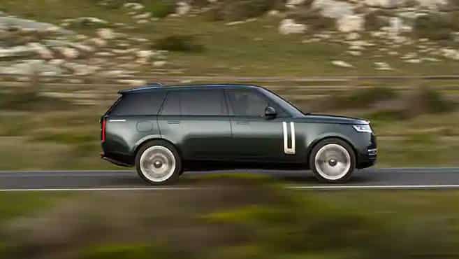 Range Rover in Green driving on the road