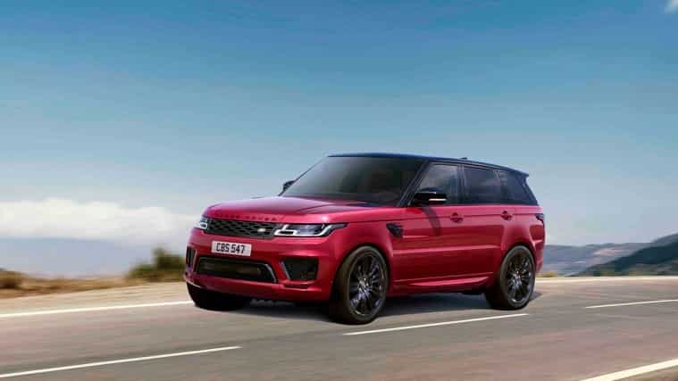 Range Rover Sport in red driving on road