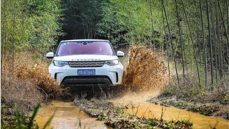Land Rover Discovery driving through water