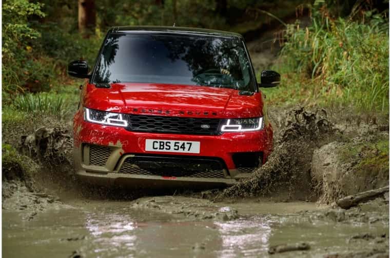 Range Rover Sport driving through mud