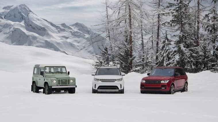 Land Rover Vehicles parked in the snow