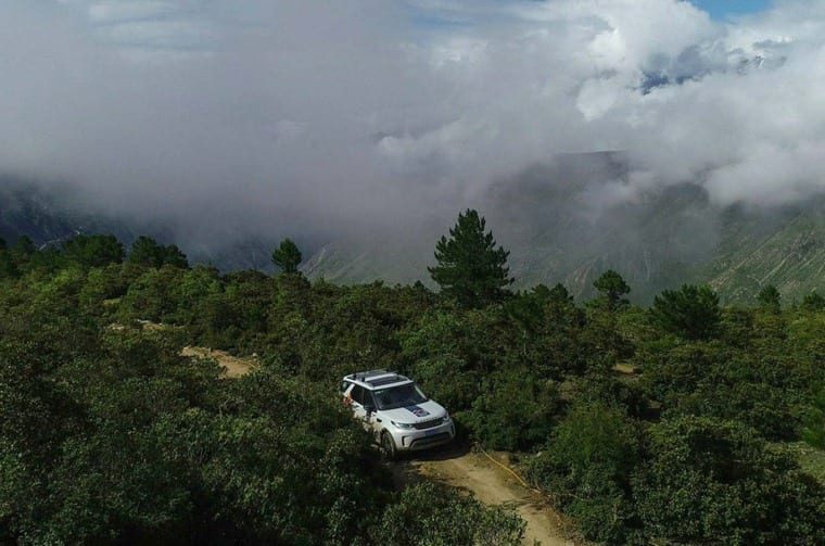 Land Rover Discovery driving on mountain road