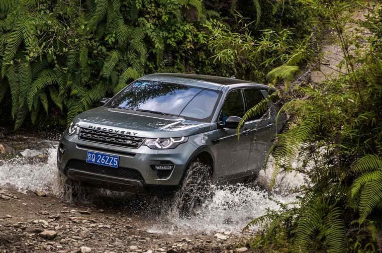 Land Rover Discovery driving through water