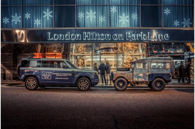 Land Rover Series I and Land Rover Defender 110 parked outside London Hilton on Park Lane
