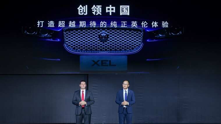 Two people presenting the Jaguar XEL