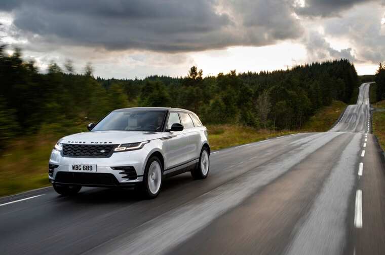 Range Rover driving on road